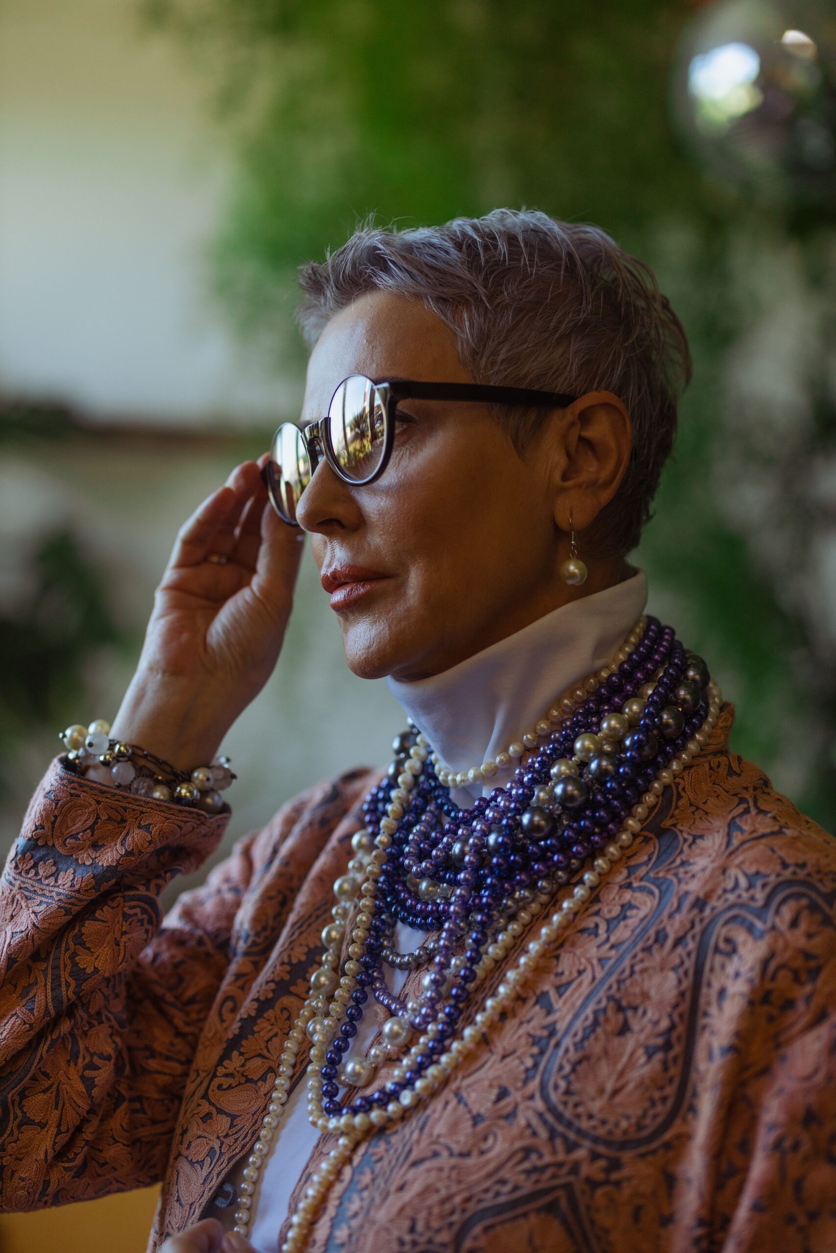 Elegant mature woman in statement jewellery wearing our trending pieces